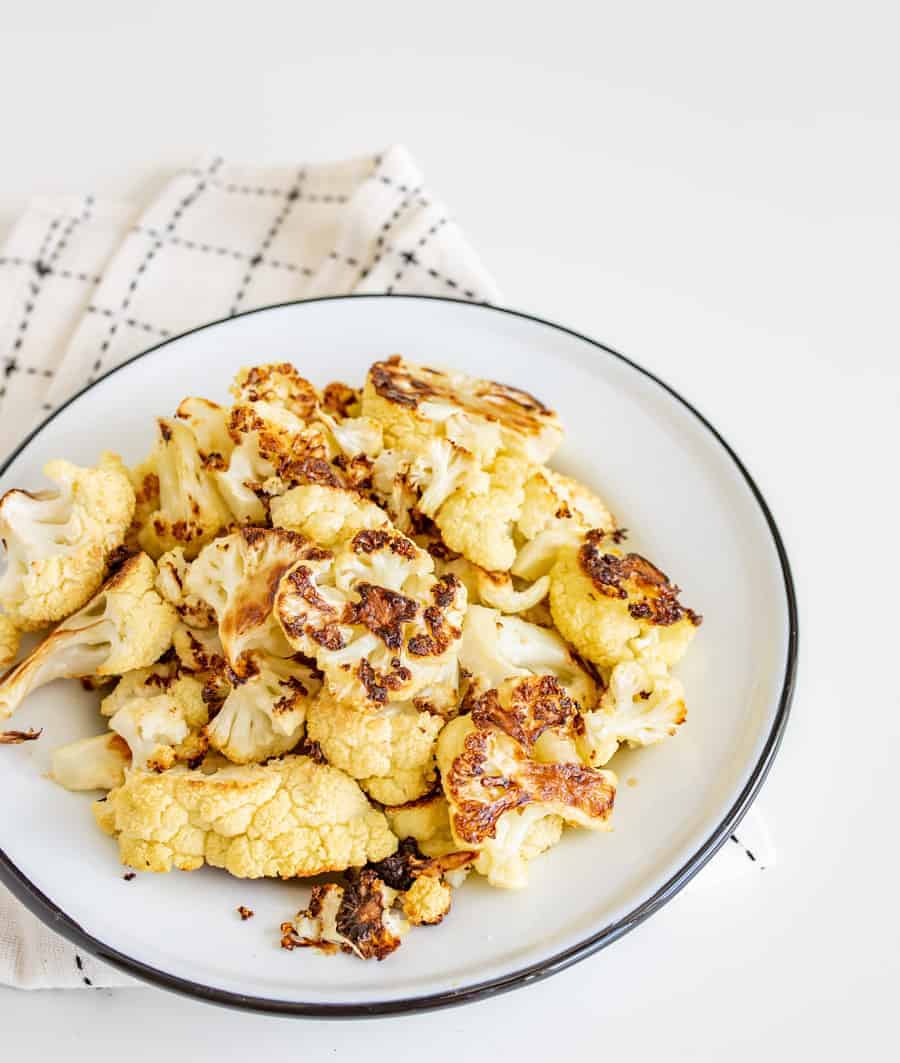 Easy Roasted Cauliflower only requires three basic ingredients and comes together to make a crunchy, decadent side to any meal.