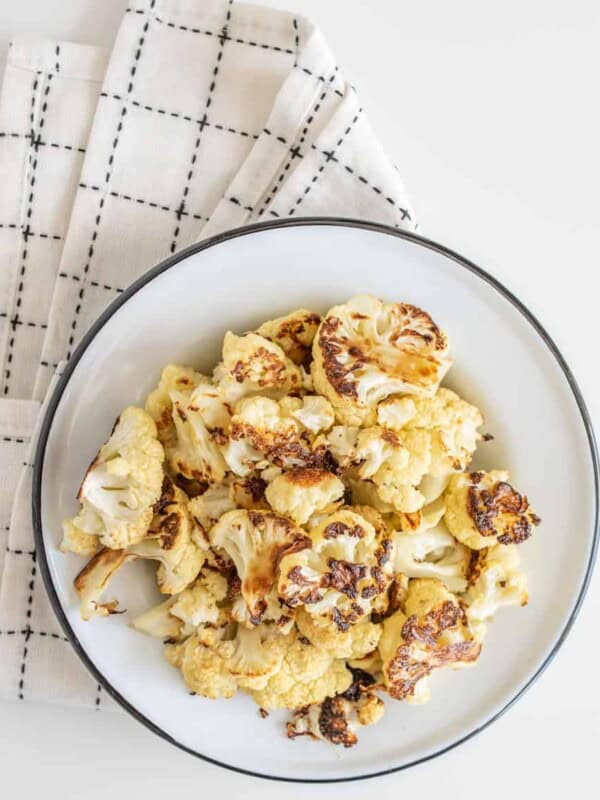 Easy Roasted Cauliflower only requires three basic ingredients and comes together to make a crunchy, decadent side to any meal.