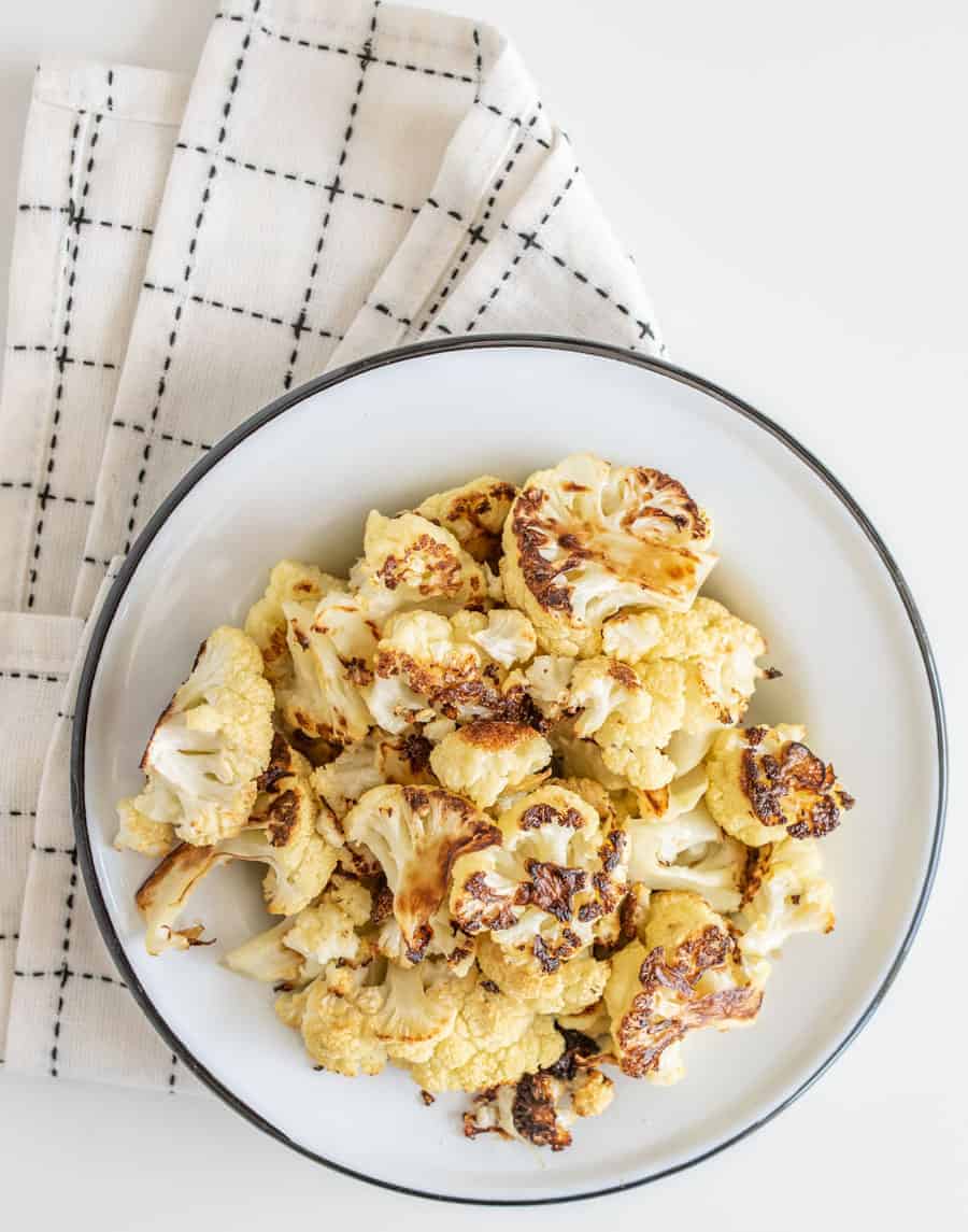 Easy Roasted Cauliflower only requires three basic ingredients and comes together to make a crunchy, decadent side to any meal.