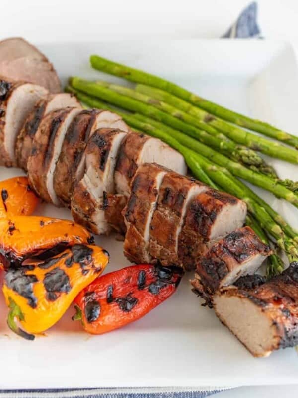 Brown Sugar and Garlic Grilled Pork Tenderloin is robust and smoky with a nice sweet-to-savory ratio. Fire up the grill because this is your new go-to summertime barbecue meat.