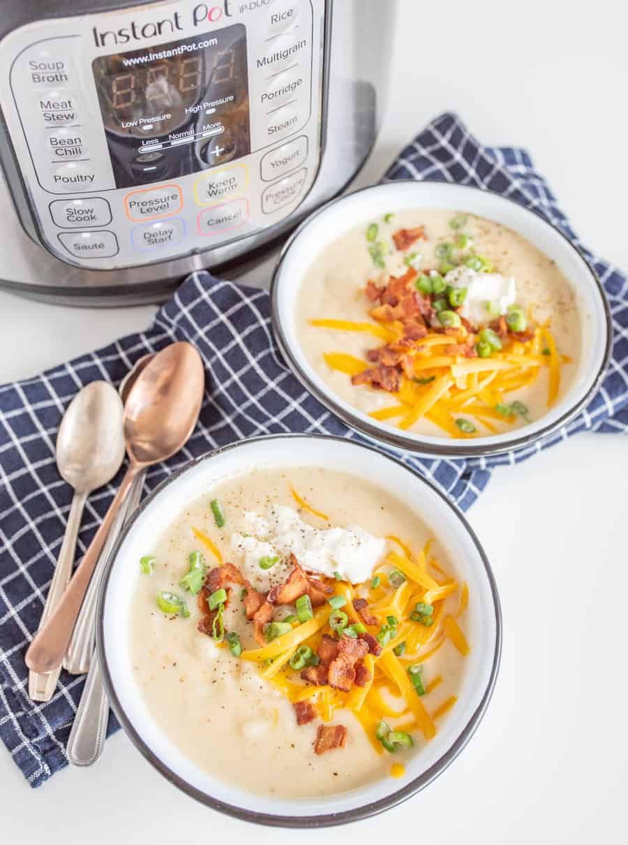 All the heartiness of a baked potato comes together in this rich and fast-as-can-be Instant Pot Loaded Baked Potato Soup, topped with shredded cheddar, crispy bacon bits, green onion, and sour cream.