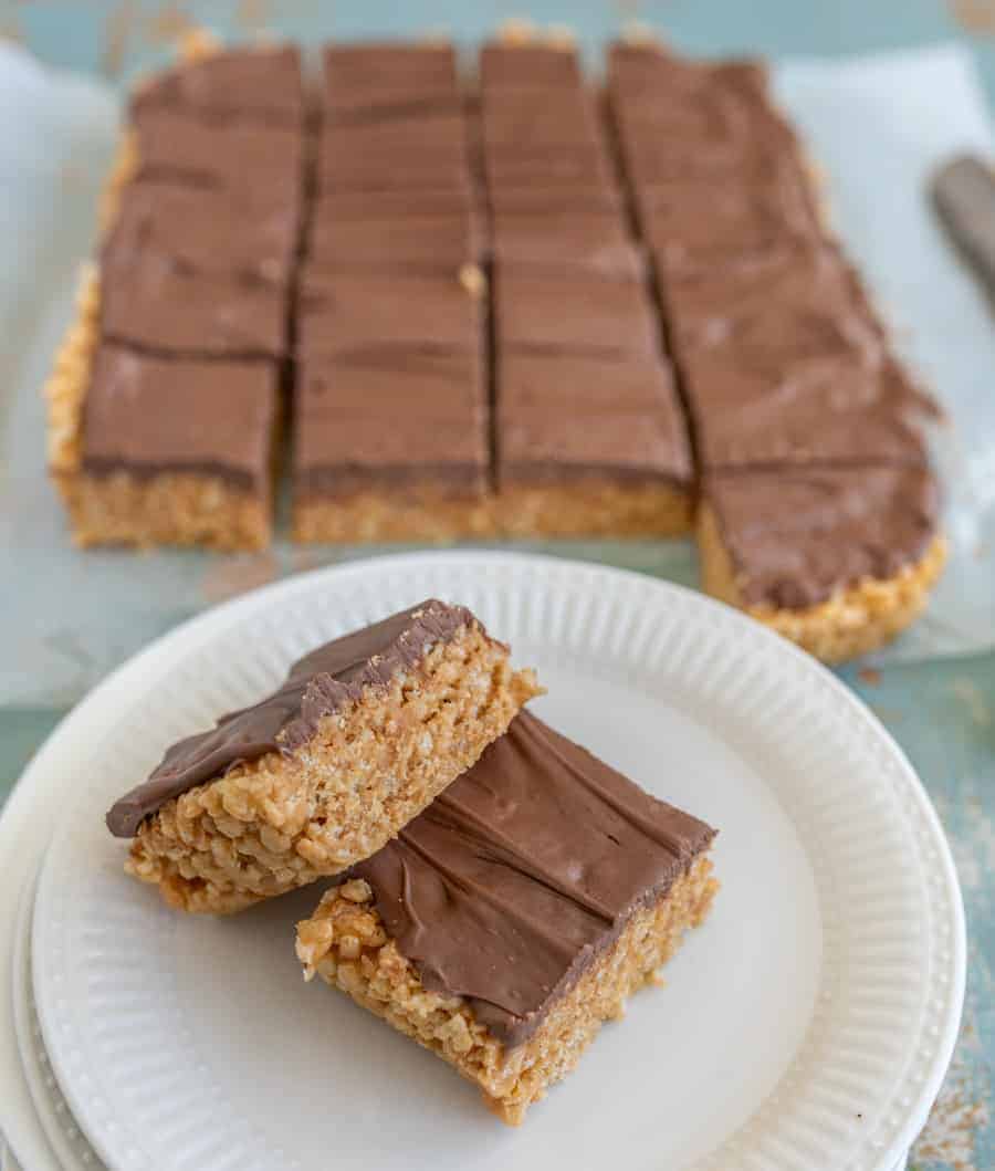 No-bake Scotcheroos combine the delightful flavors of butterscotch, chocolate, and peanut butter with the perfect amount of crunch from crispy rice cereal.