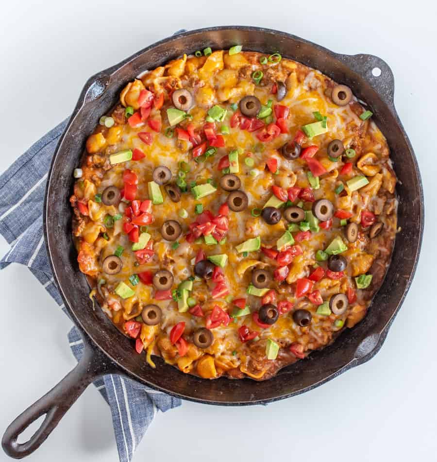 Cheesy, creamy, and packed with shell noodles, ground beef, lots of tomatoes, and all your favorite Tex-Mex toppings, one-pot Skillet Taco Pasta is as dreamy as it is filling and flavorful.