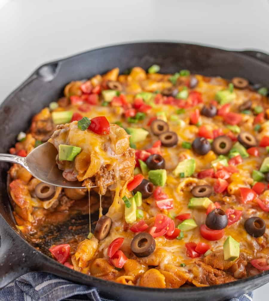 Cheesy, creamy, and packed with shell noodles, ground beef, lots of tomatoes, and all your favorite Tex-Mex toppings, one-pot Skillet Taco Pasta is as dreamy as it is filling and flavorful.