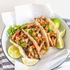 This smoky and Crispy Sheet Pan Baked Chicken Taco Meat creates tender bites of chicken thigh with the use of lime, cilantro, cumin, chili powder, and more savory spices that are perfect to wrap up in tortillas.