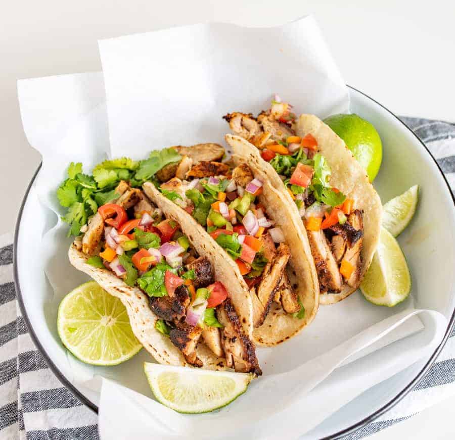 This smoky and Crispy Sheet Pan Baked Chicken Taco Meat creates tender bites of chicken thigh with the use of lime, cilantro, cumin, chili powder, and more savory spices that are perfect to wrap up in tortillas.