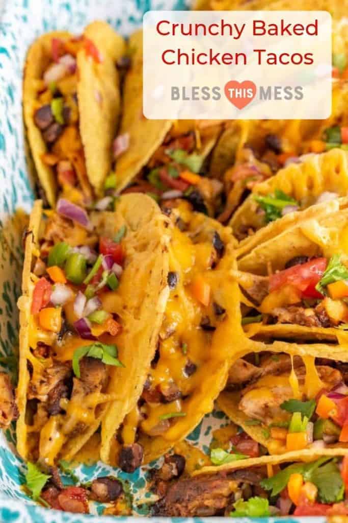 Crispy and Crunchy Baked Chicken Tacos are a quickly thrown-together and satisfying meal, complete with baked chicken, taco seasoning, black beans, hard taco shells, and plenty of shredded cheddar cheese.