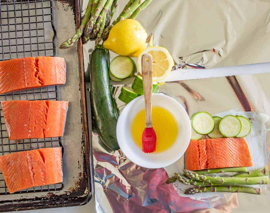 A fresh and fast meal, Grilled Salmon Foil Packs with Veggies couldn't be easier to toss together and grill up quickly with the simple flavorings of some lemon, butter, salt, and pepper.