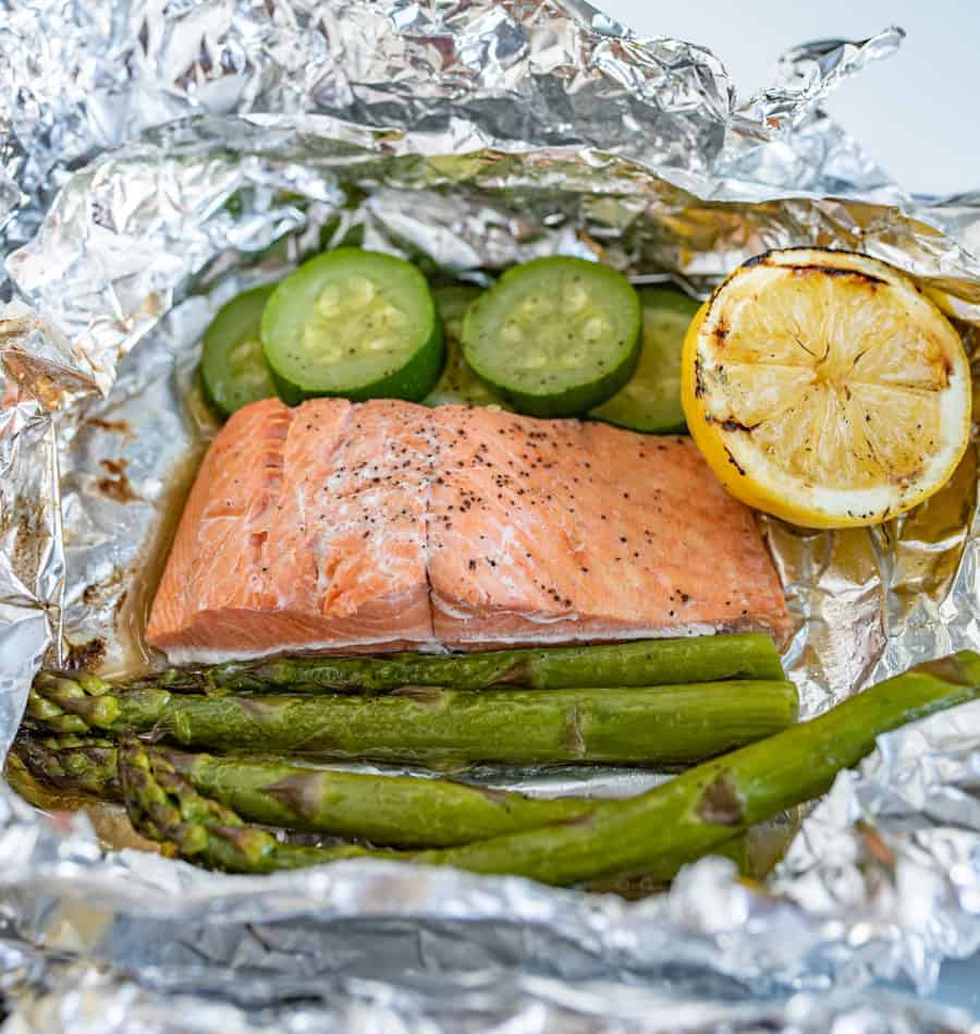 grilled salmon and vegetables in an open foil packet