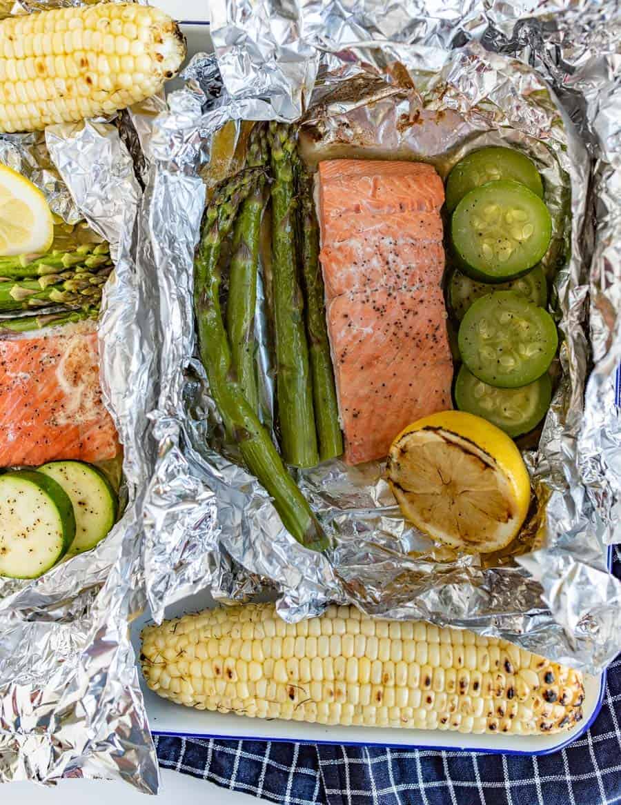 A fresh and fast meal, Grilled Salmon Foil Packs with Veggies couldn't be easier to toss together and grill up quickly with the simple flavorings of some lemon, butter, salt, and pepper.