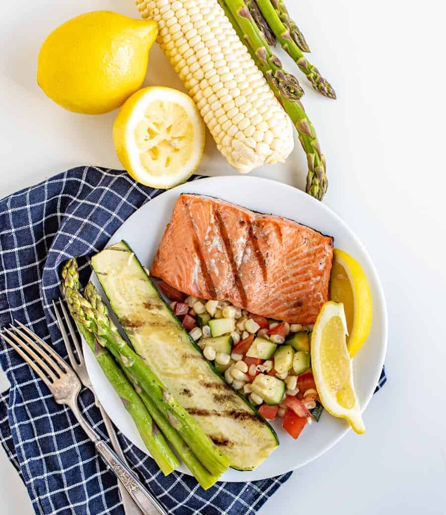 This Easy Grilled Salmon Recipe is perfect for grill novices to learn how to grill salmon. It's flakey, lemony, and salty in all the best ways, and comes together with little time or effort!