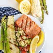 This Easy Grilled Salmon Recipe is perfect for grill novices to learn how to grill salmon. It's flakey, lemony, and salty in all the best ways, and comes together with little time or effort!