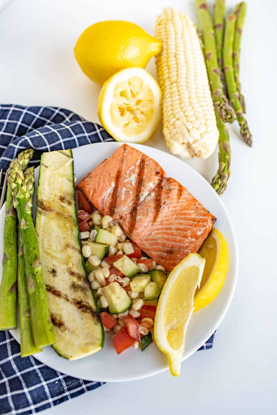 This Easy Grilled Salmon Recipe is perfect for grill novices to learn how to grill salmon. It's flakey, lemony, and salty in all the best ways, and comes together with little time or effort!