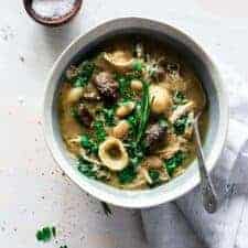 top view Italian chicken mushroom soup in a white bowl