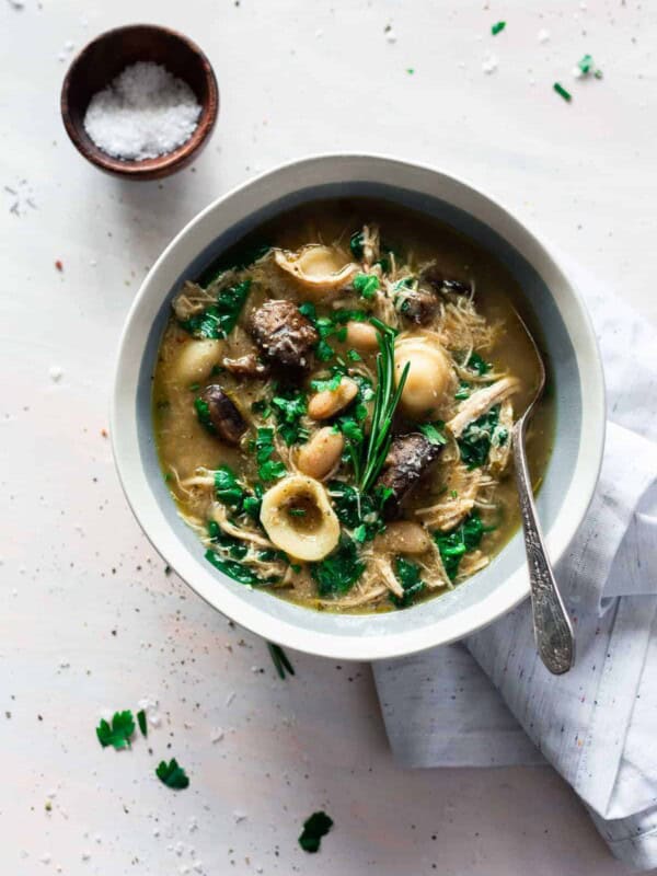 top view Italian chicken mushroom soup in a white bowl