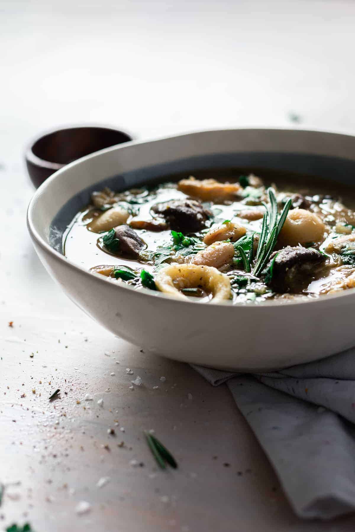 Flavorful and hearty, this Italian chicken and mushroom soup is warming to the soul and is totally easy to make a big batch of on a chilly night! Packed with flavor and delicious ingredients, you'll love this soup for fall and winter nights when all you want is something warm and comforting. #italiansoup #soup #chickensoup #mushroomsoup #souprecipes #italianrecipes