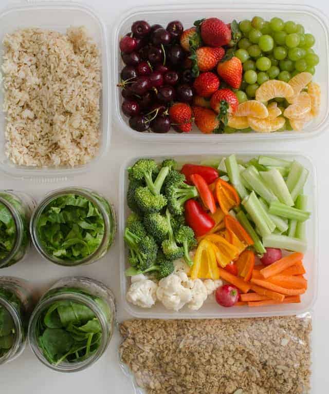 vegetables and fruit and rice in containers.