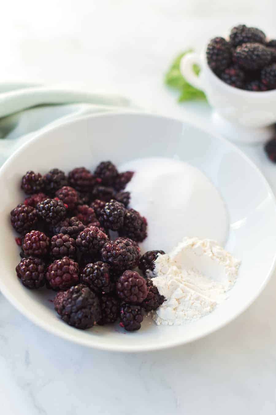 Raspberry cobbler made with black raspberries and a flaky pie crust is a favorite family dessert passed down by my grandmother. #raspberrycobbler #cobbler #raspberry #dessert #baking #familyrecipe