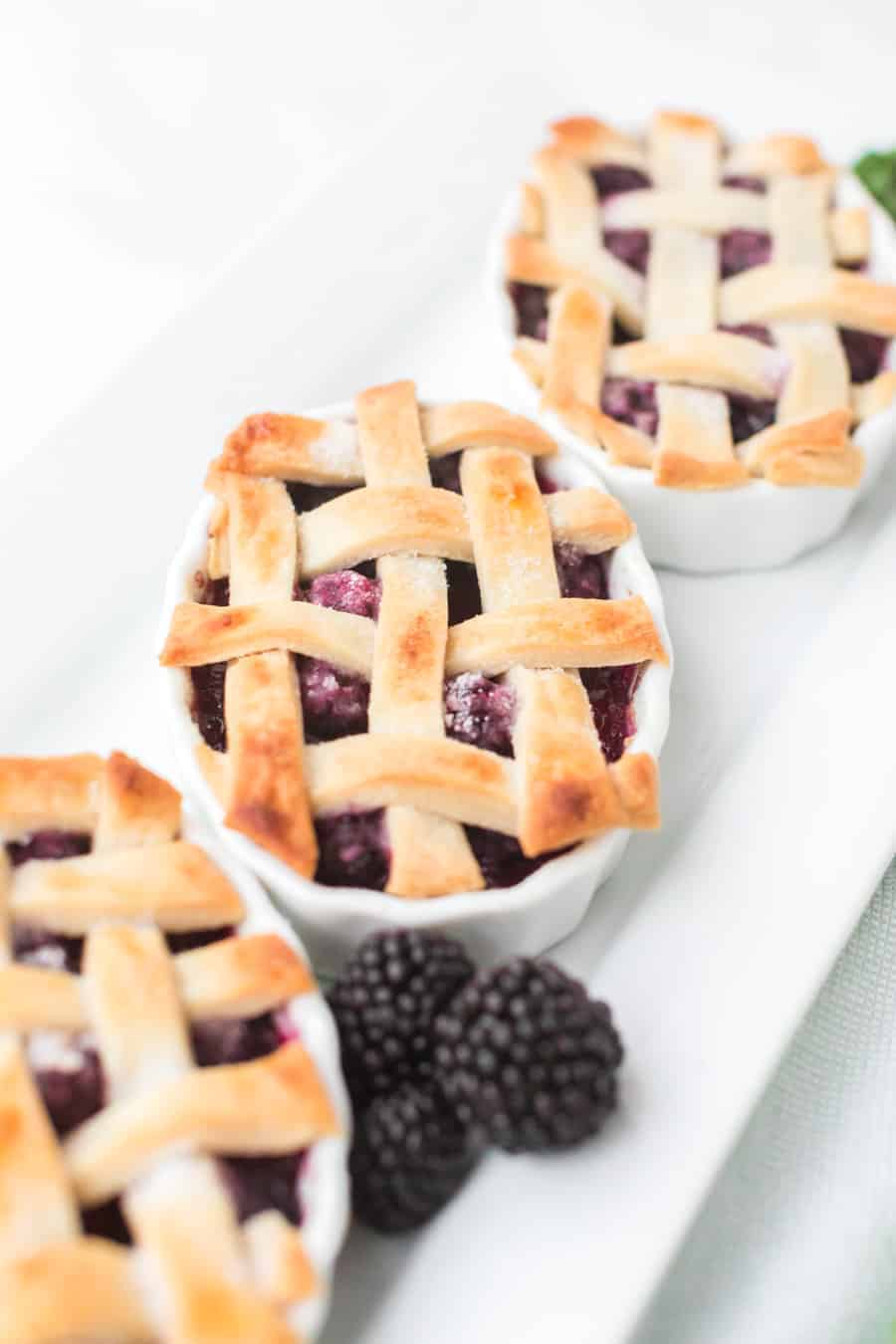 Raspberry cobbler made with black raspberries and a flaky pie crust is a favorite family dessert passed down by my grandmother. #raspberrycobbler #cobbler #raspberry #dessert #baking #familyrecipe