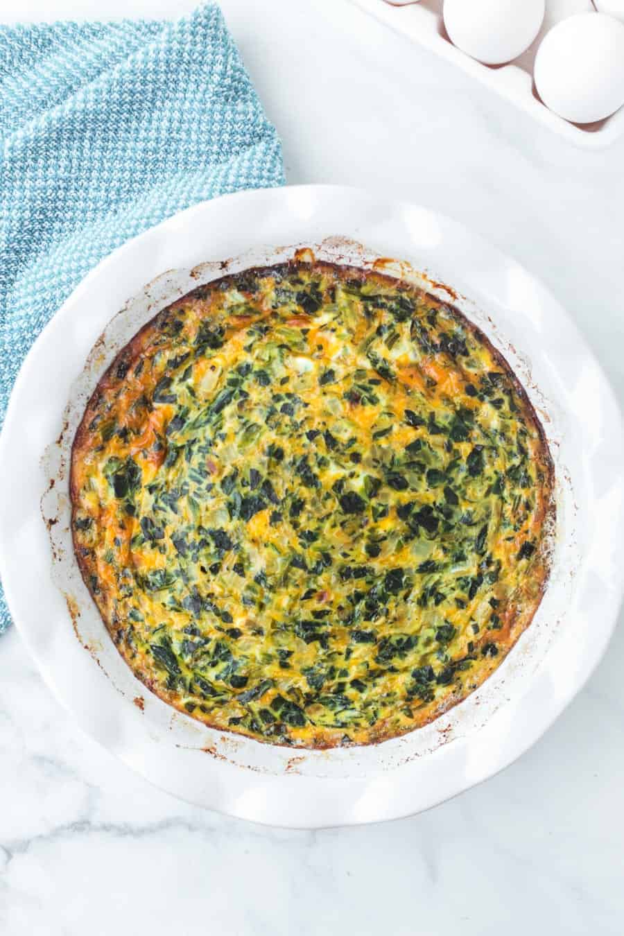 Straightforward yet flavorful, crustless spinach quiche is an easy and healthy breakfast that you can customize or keep simple! #spinachquiche #crustlessquiche #breakfast #quiche #healthybreakfasts