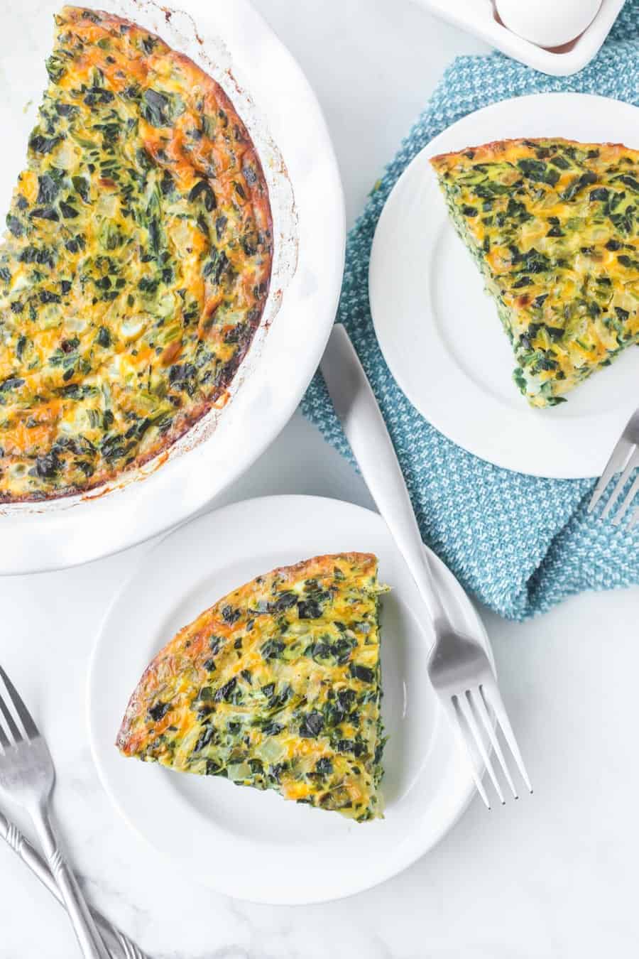 Straightforward yet flavorful, crustless spinach quiche is an easy and healthy breakfast that you can customize or keep simple! #spinachquiche #crustlessquiche #breakfast #quiche #healthybreakfasts