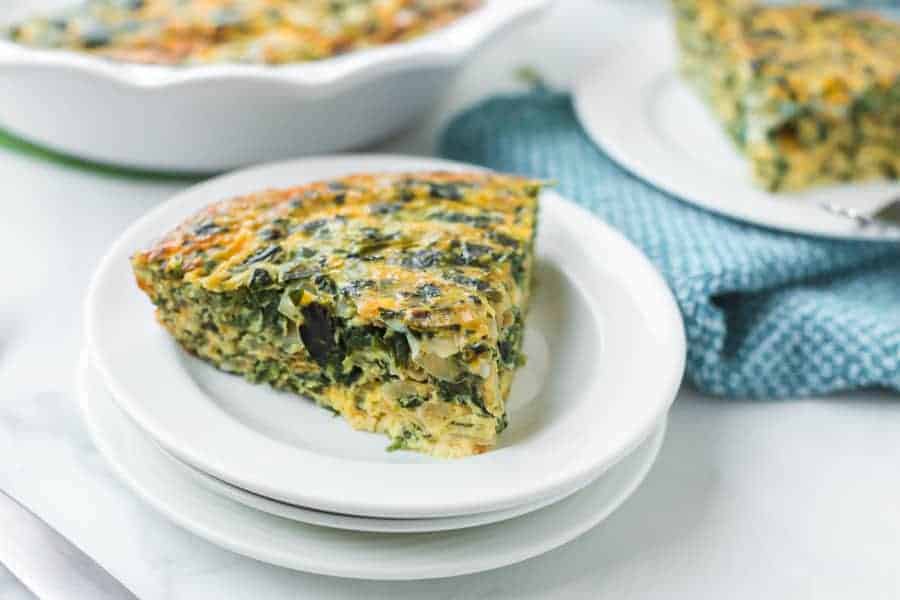 Straightforward yet flavorful, crustless spinach quiche is an easy and healthy breakfast that you can customize or keep simple! #spinachquiche #crustlessquiche #breakfast #quiche #healthybreakfasts