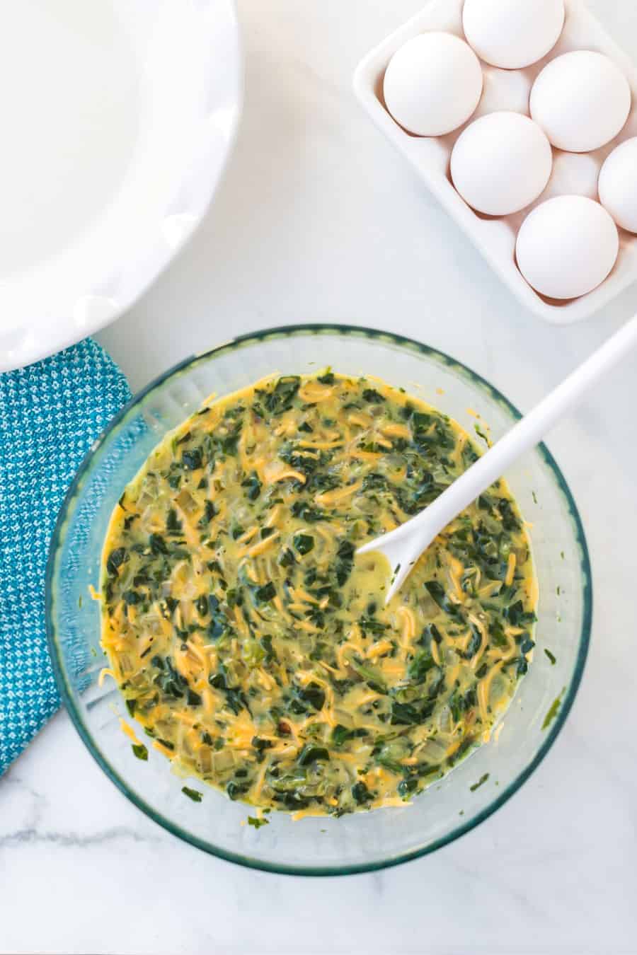 Straightforward yet flavorful, crustless spinach quiche is an easy and healthy breakfast that you can customize or keep simple! #spinachquiche #crustlessquiche #breakfast #quiche #healthybreakfasts