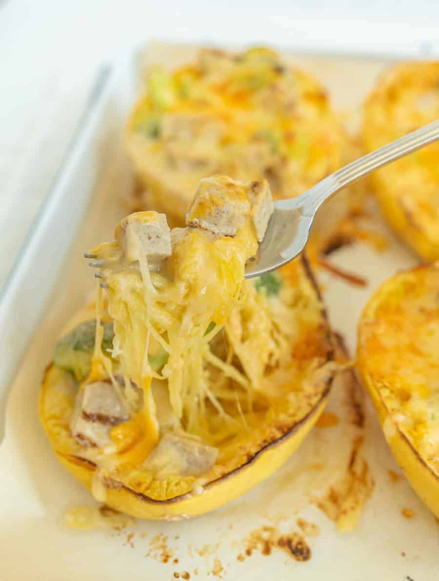 Rich and gooey, this cheesy chicken and broccoli stuffed spaghetti squash is low carb and packed full of flavor and filling nutrients! #spaghettisquash #chicken #cheese #broccoli #healthydinners #easydinners