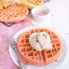 cake batter waffles with sprinkles and whipped cream