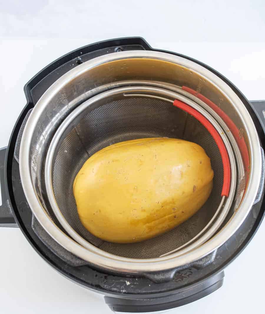You will love this trick for how to cook spaghetti squash in the Instant Pot for the fastest (and easiest) spaghetti squash recipe ever. #spaghettisquash #instantpot #dinnerhacks #simplerecipes