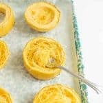 shredded spaghetti squash on a baking dish