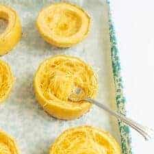 shredded spaghetti squash on a baking dish