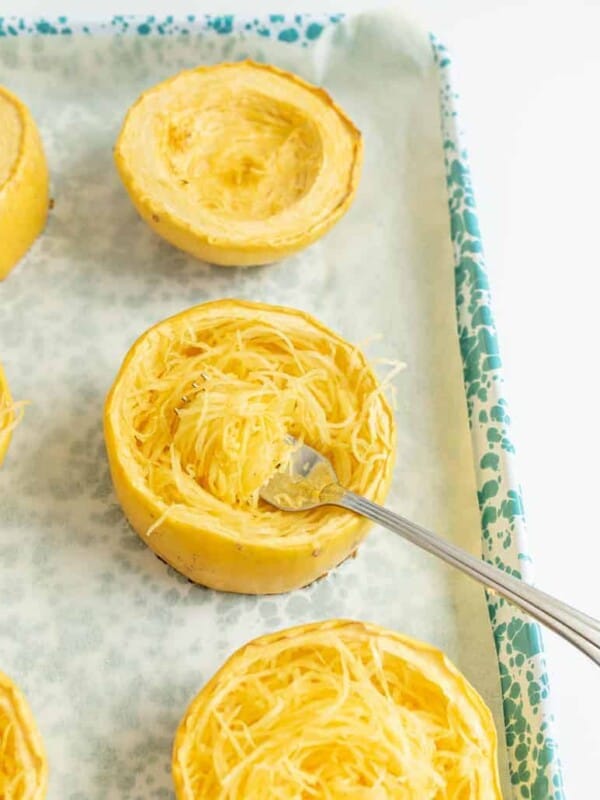 shredded spaghetti squash on a baking dish