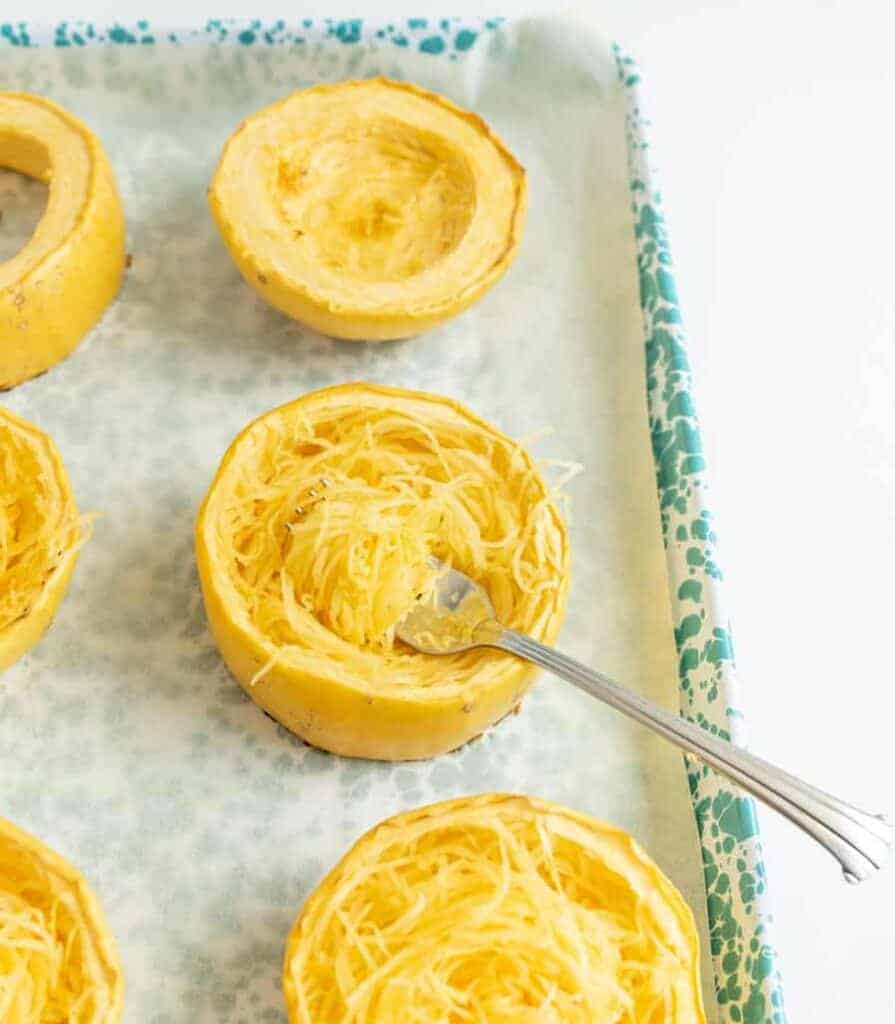 shredded spaghetti squash on a baking dish