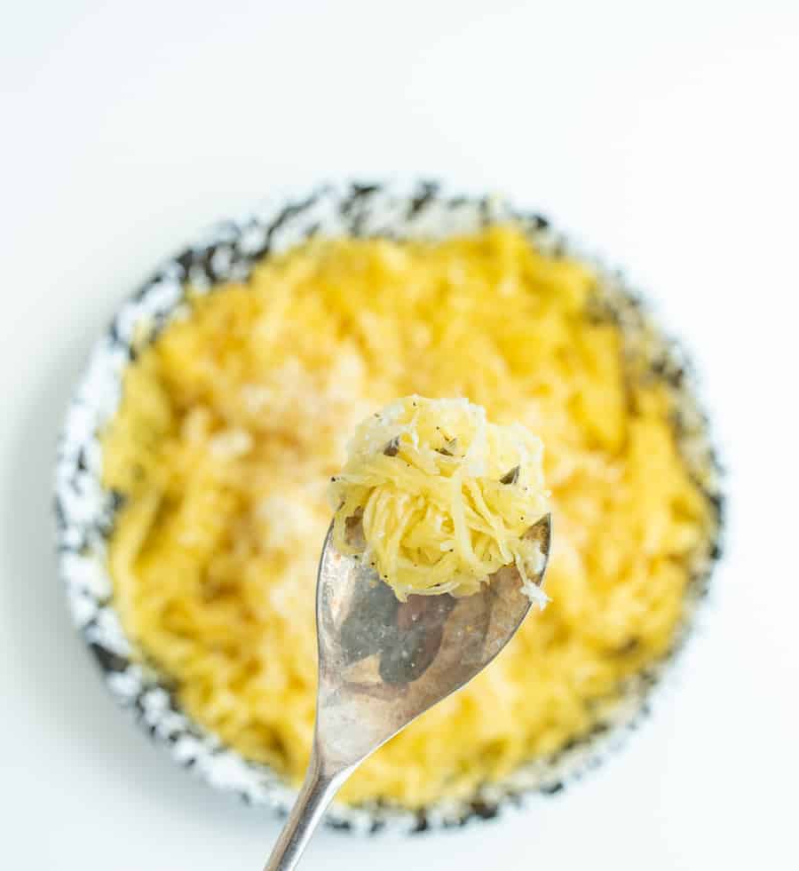 A classic, simple, and delicious pasta dish is reinvented with this spaghetti squash with butter and parmesan recipe! #spaghettisquash #lowcarb #spaghettisquashrecipe #easyweeknightmeals