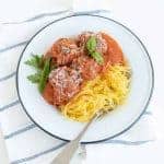 photo of spaghetti squash with meatballs and tomato sauce in a white bowl