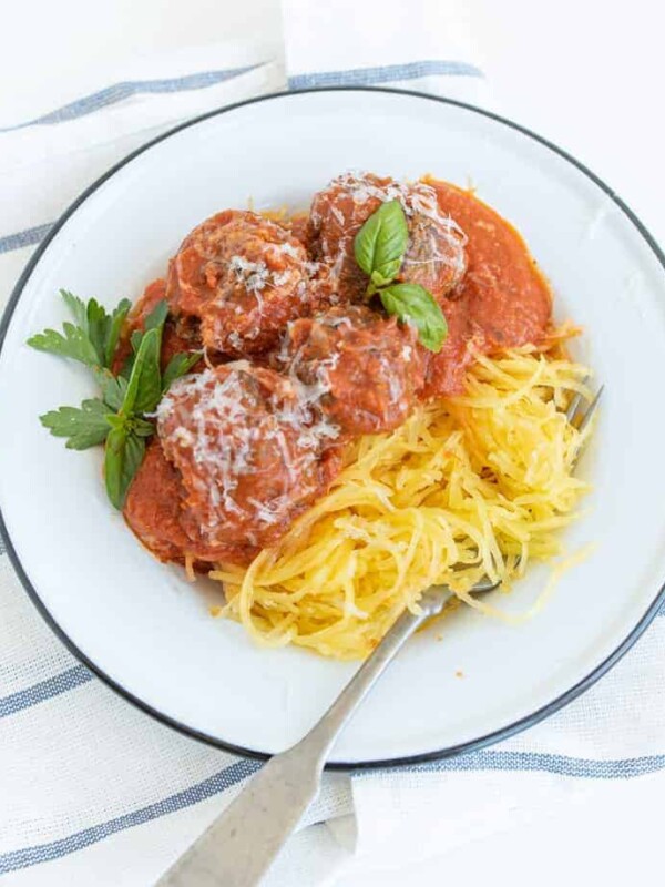 photo of spaghetti squash with meatballs and tomato sauce in a white bowl
