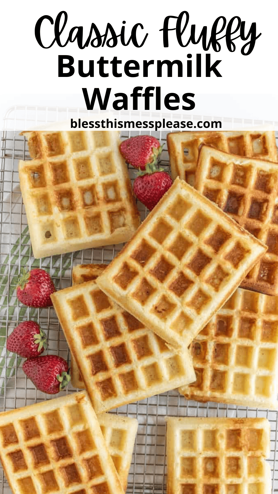 Golden brown buttermilk waffles stacked on a cooling rack with fresh strawberries. The text reads Classic Fluffy Buttermilk Waffles and blessthismessplease.com.