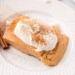 a plate of pumpkin pudding with whipped topping