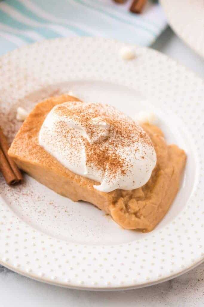 a plate of pumpkin pudding with whipped topping