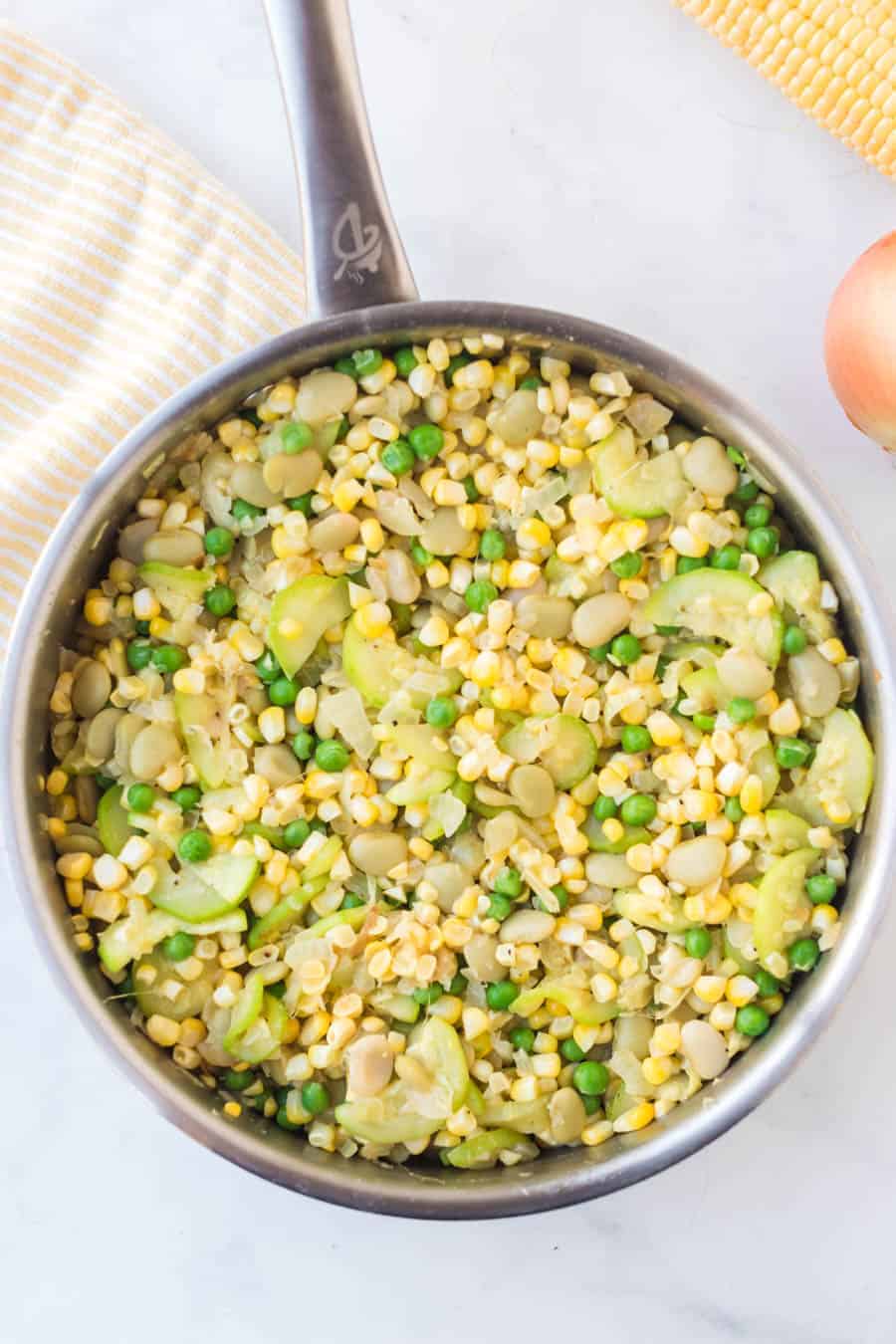corn, squash, and bean side dish in a pot.