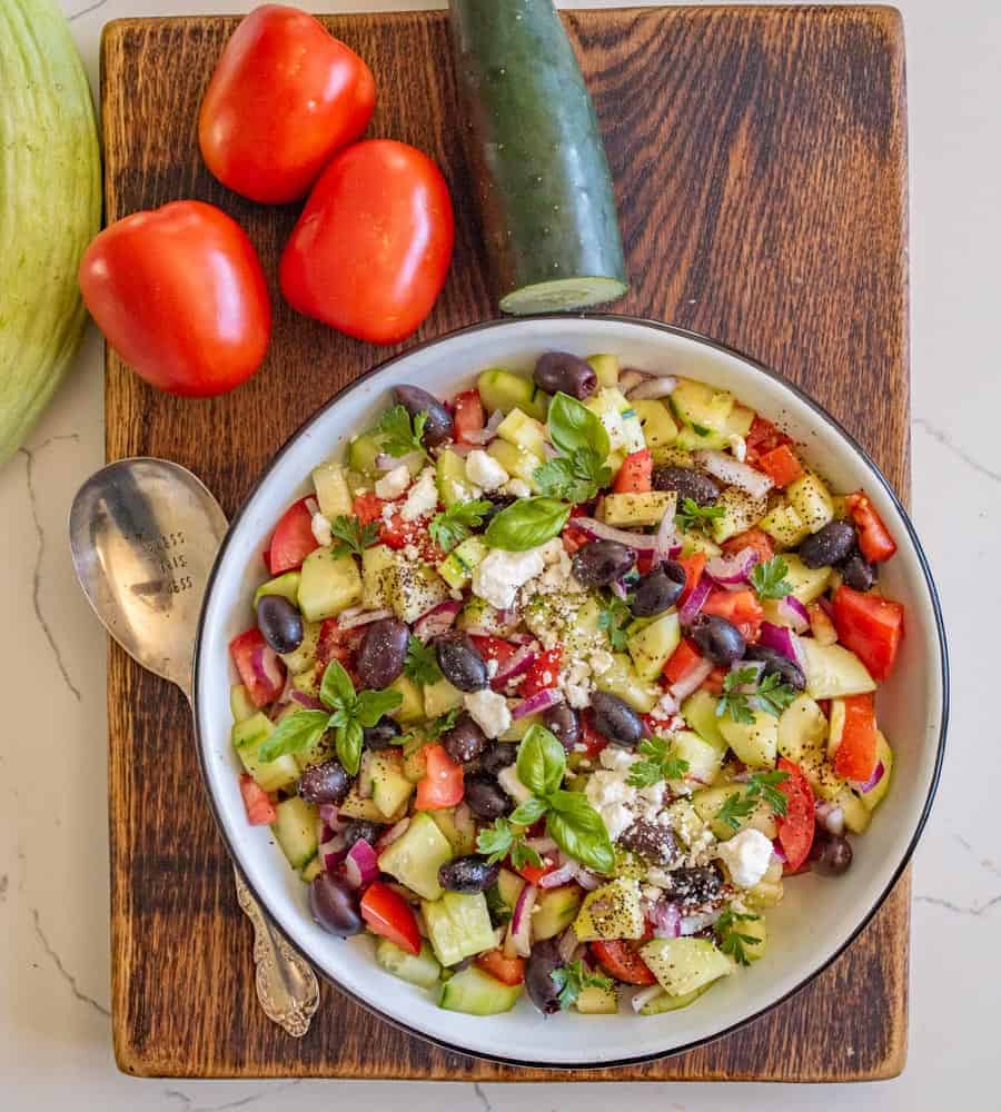 A refreshing and easy taste of summer, this Mediterranean cucumber salad is packed with fresh ingredients and flavors that you can totally make your own! #olives #healthy #salad #cucumber