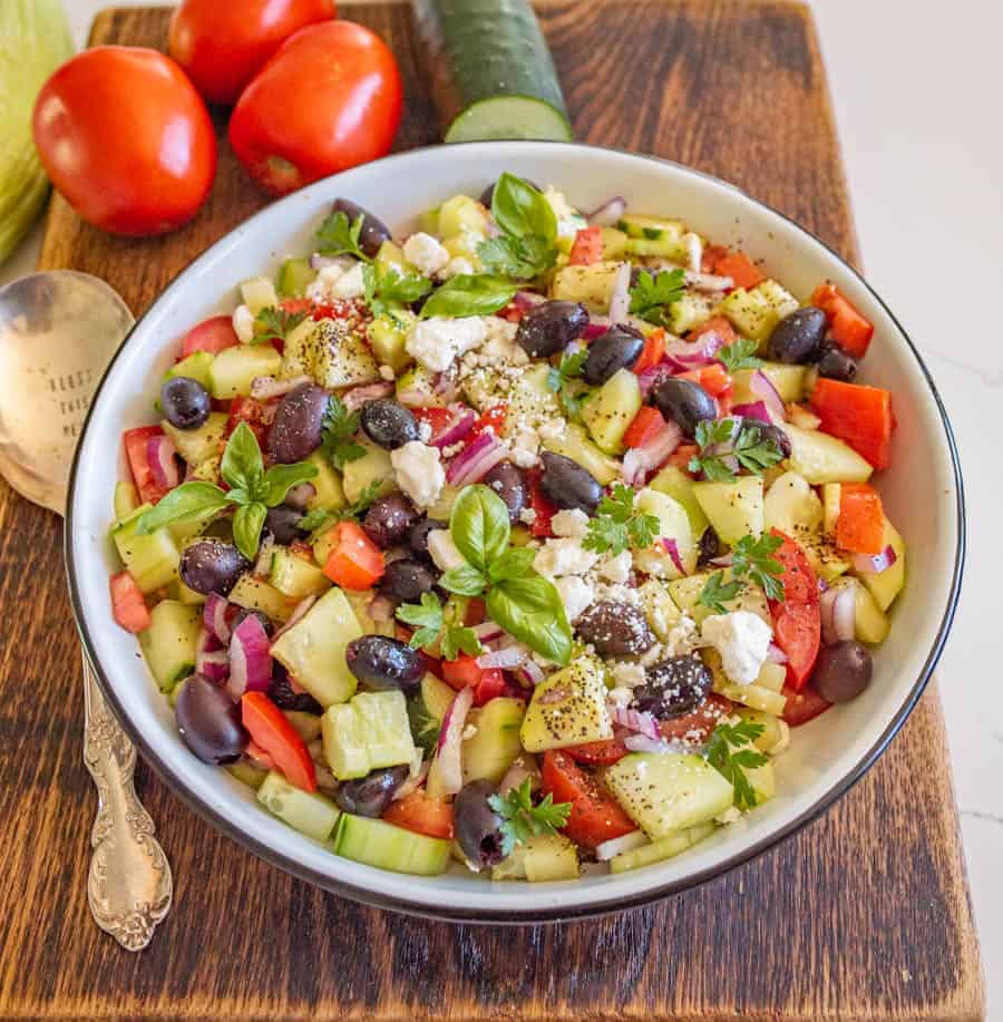 A refreshing and easy taste of summer, this Mediterranean cucumber salad is packed with fresh ingredients and flavors that you can totally make your own! #olives #healthy #salad #cucumber