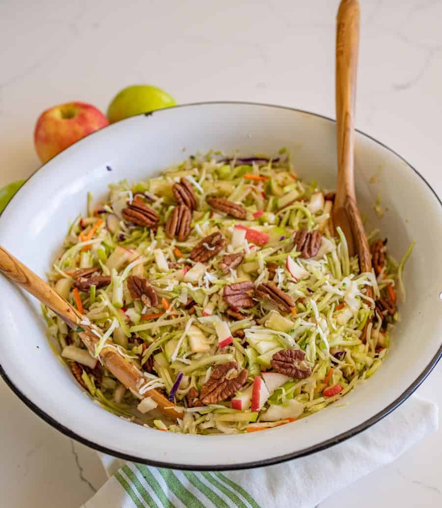 Apple cabbage salad with pecans is a crunchy and bright salad similar to cole slaw with just a hint of sweetness from the fruit. #cabbagesalad #coleslaw #applecabbagesalad #applesalad #cabbage #salad