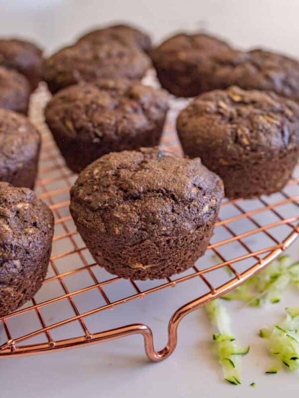 chocolate zucchini muffins on a cooling rack