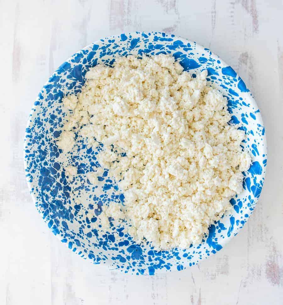 fresh cottage cheese on a blue speckled plate