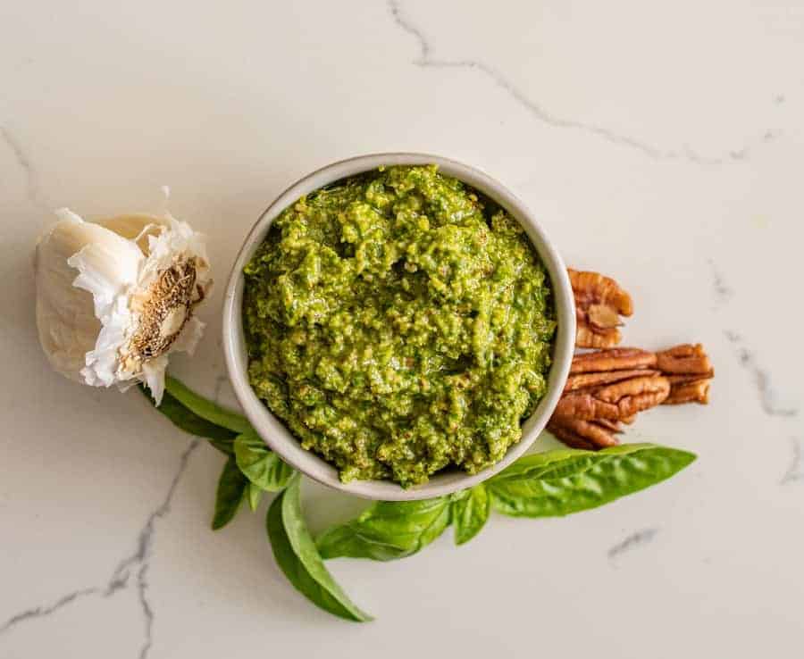 Homemade pesto is a simple and adaptable recipe that you can use as marinade, in sandwiches, on pasta, or over roasted veggies. Plus, it's full of fresh flavors and wholesome ingredients. #pesto #pestorecipe #basil #italian #homemadepesto