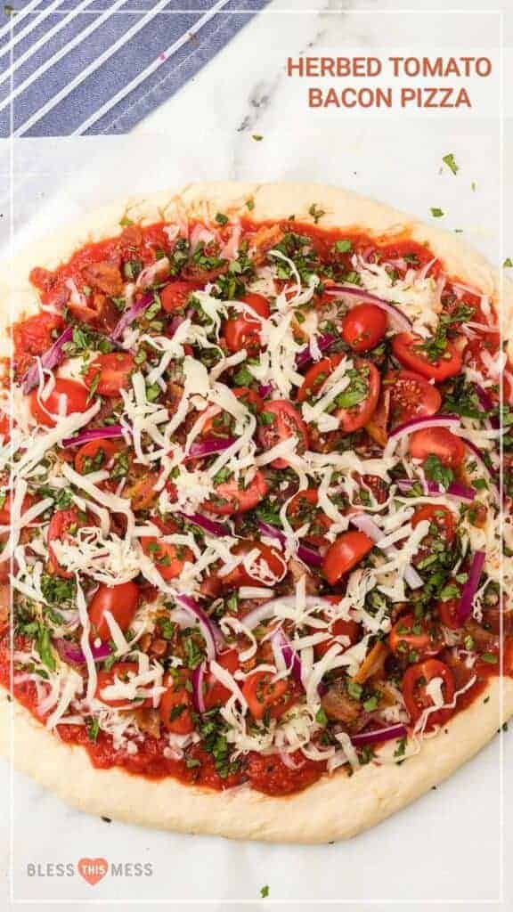 text reads "herbed tomato bacon pizza" bacon tomato onion and cheese on a pizza