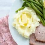 close up of thanksgiving dinner on a white plate