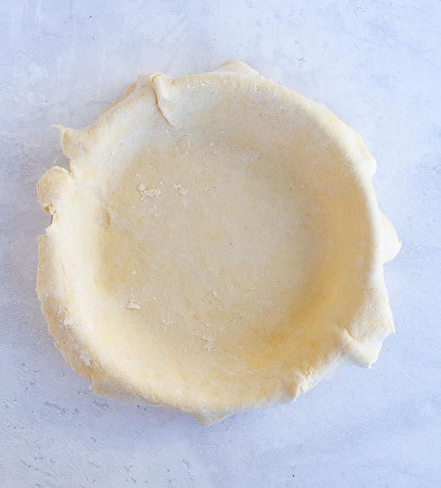 This buttery and flaky all butter pie crust is such a simple recipe with just 4 ingredients, and the perfect crust for all your favorite pies! Get you homemade pie baking on with this super simple, super perfect pie crust made without any shortening as the fat -- just butter! #butterpiecrust #piecrust #piecrustrecipe #pie #pierecipe #allbutterpiecrust #holidaybaking #pies